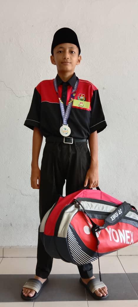 Valberg Academy student holding a tournament trophy